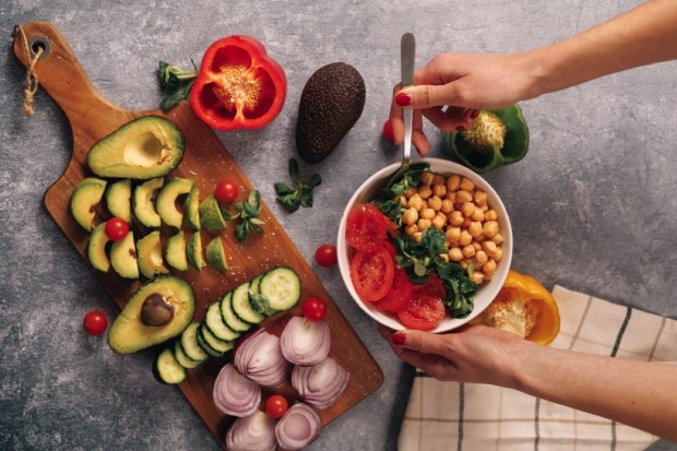 wholesome plant-powered bowl surrounded by vegetables