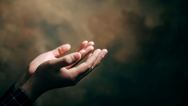 praying hands with faith in religion and belief in God
