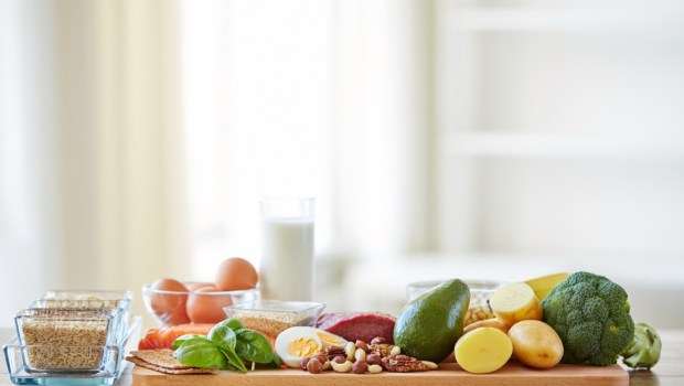 close up of vegetables, fruits and meat on wooden table