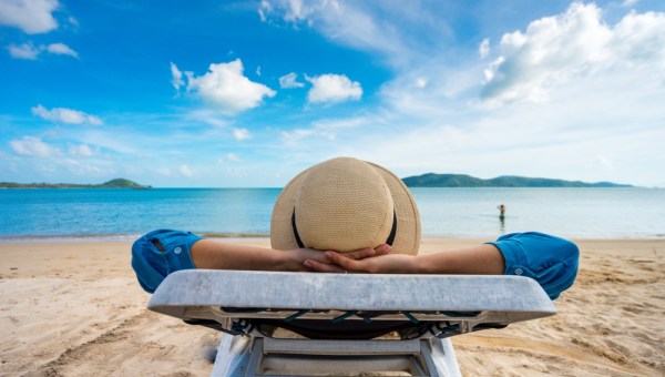 Young woman relaxing on beach, ocean view, Vacation Outdoors Seascape Concept