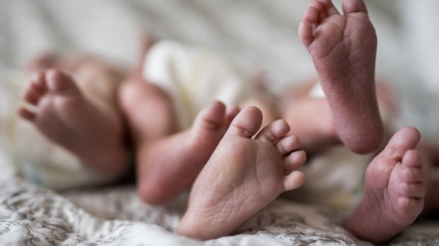 Feet of newborn triplets baby
