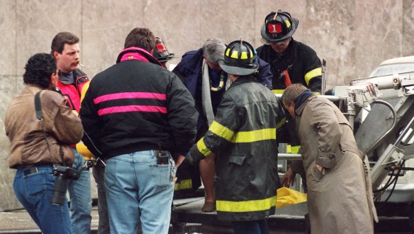 Emergency workers attend person injured in World Trade Center attack