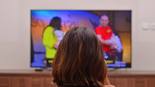 Istanbul, Turkey : August 17, 2017: Woman is watching quiz show on local channels of Turkey.