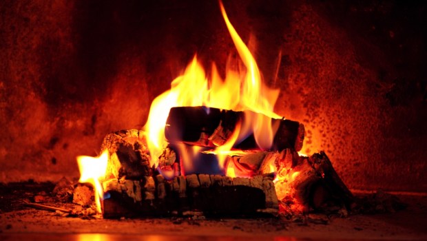 Close up shot of burning firewood in the fireplace