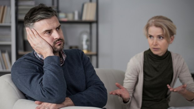 Upset man refusing to listen to his constantly complaining wife