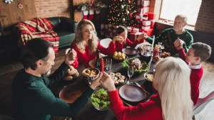 family around table on Christmas