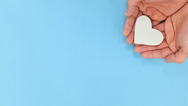 Hands-holding-a-white-heart