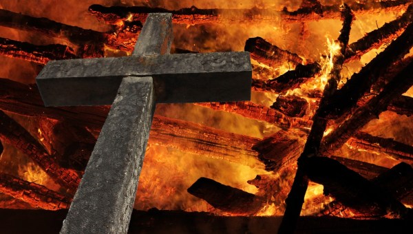 The large cross of stone in front of the fire