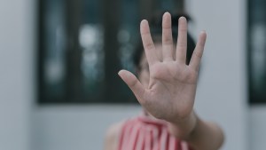 hand-showing-stop-gesture-and-Violence