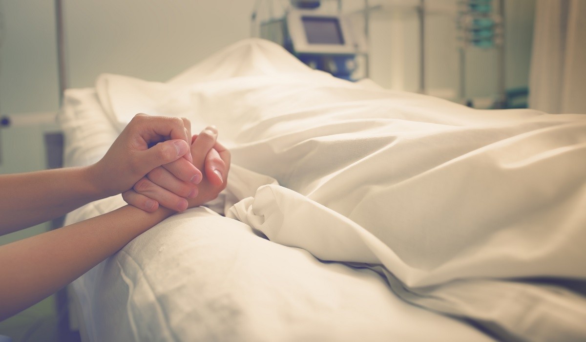 hands mourning dead loved one