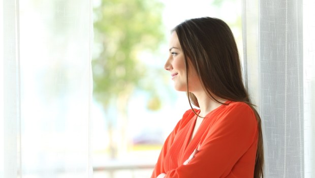 Side view portrait of a thoughtful attractive female
