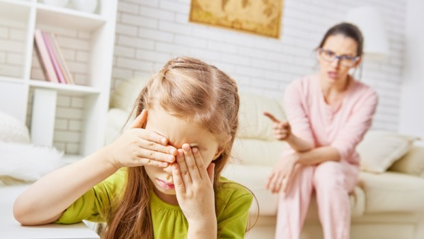 mother scolds her child girl
