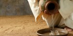 Jesus pouring water from a jar before the feet washing