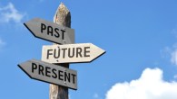 "Past, future, present" - wooden signpost, cloudy sky