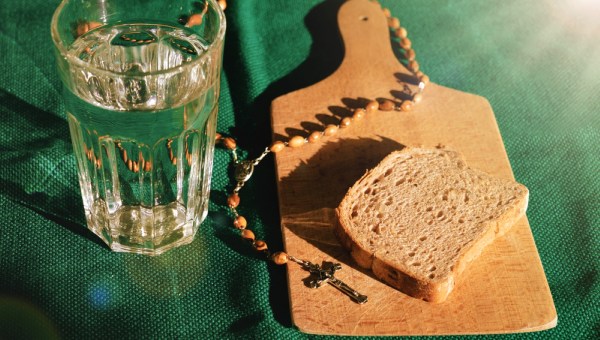 bread and water lent before easter with rosary beads