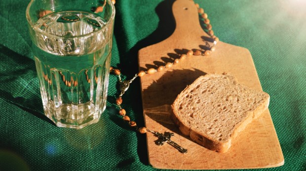 bread and water lent before easter with rosary beads