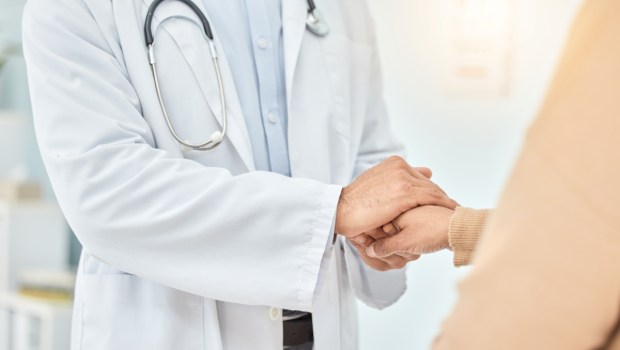 Doctor, patient and helping hand, empathy and communication