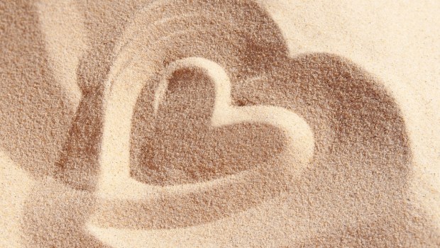 Heart drawn on sand
