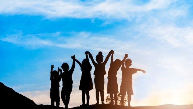 Silhouette back refugee kid group