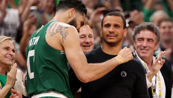Jayson Tatum #0 of the Boston Celtics hugs head coach Joe Mazzulla of the Boston Celtics during the fourth quarter of Game Five of the 2024 NBA Finals against the Dallas Mavericks at TD Garden on June 17, 2024 in Boston, Massachusetts