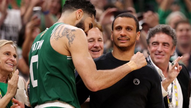 Jayson Tatum #0 of the Boston Celtics hugs head coach Joe Mazzulla of the Boston Celtics during the fourth quarter of Game Five of the 2024 NBA Finals against the Dallas Mavericks at TD Garden on June 17, 2024 in Boston, Massachusetts