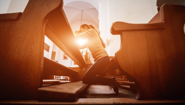 Christian woman praying in church