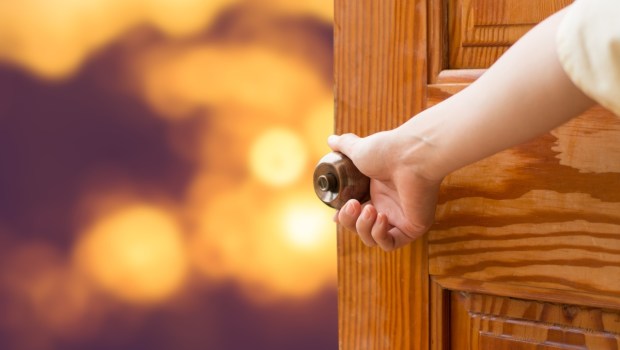 Women hand open door knob or opening the door