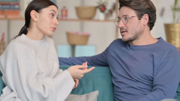couple talking in the couch