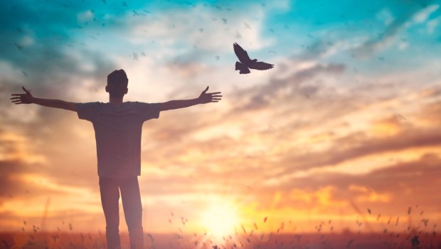 Happy man worship for peace on morning view