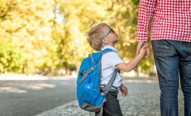 Parent taking kid to school