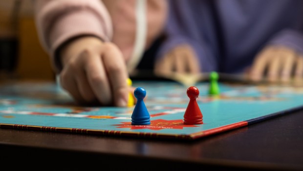 Process of playing board game and having fun with friends