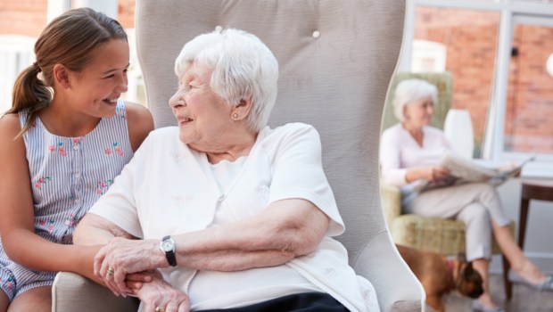 Granddaughter Visiting Grandmother In Retirement Home