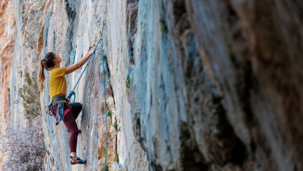 Climber overcomes challenging climbing route