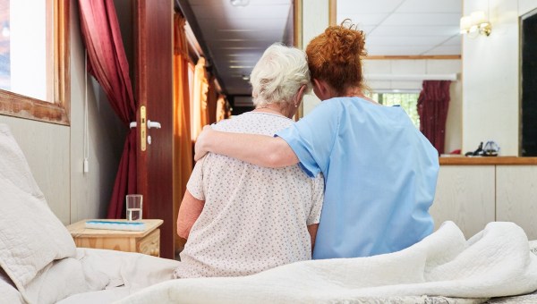Hospice nurse with elderly patient