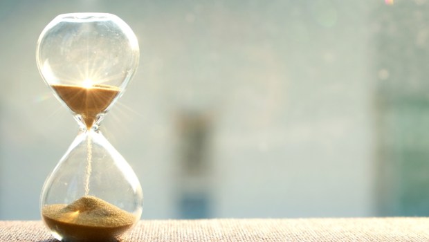 Hourglass with sun