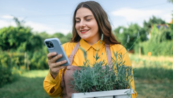 Woman at garden with phone