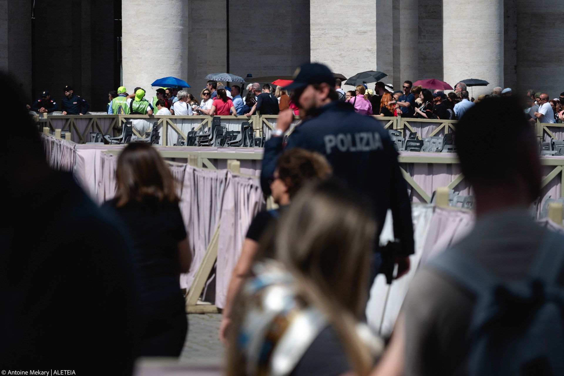 Pilgrims and visitors queue at St Peter's Square to enter St Peter's Basilica and pay respects to the late Pope in the Vatican on April 23, 2025