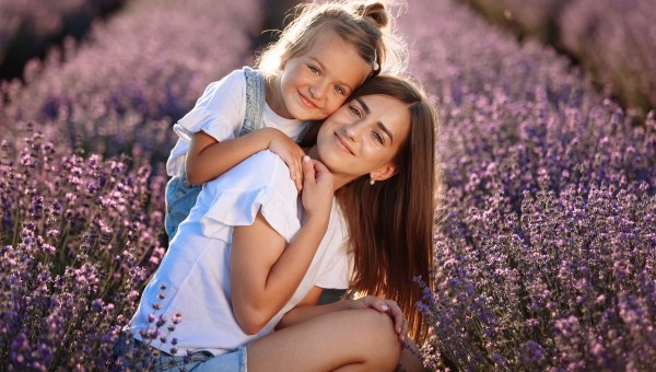 Happy family in purple lavender field