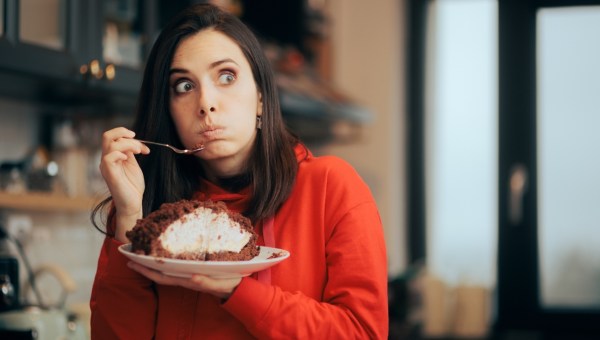 Funny Woman Feeling Guilty Eating Cake