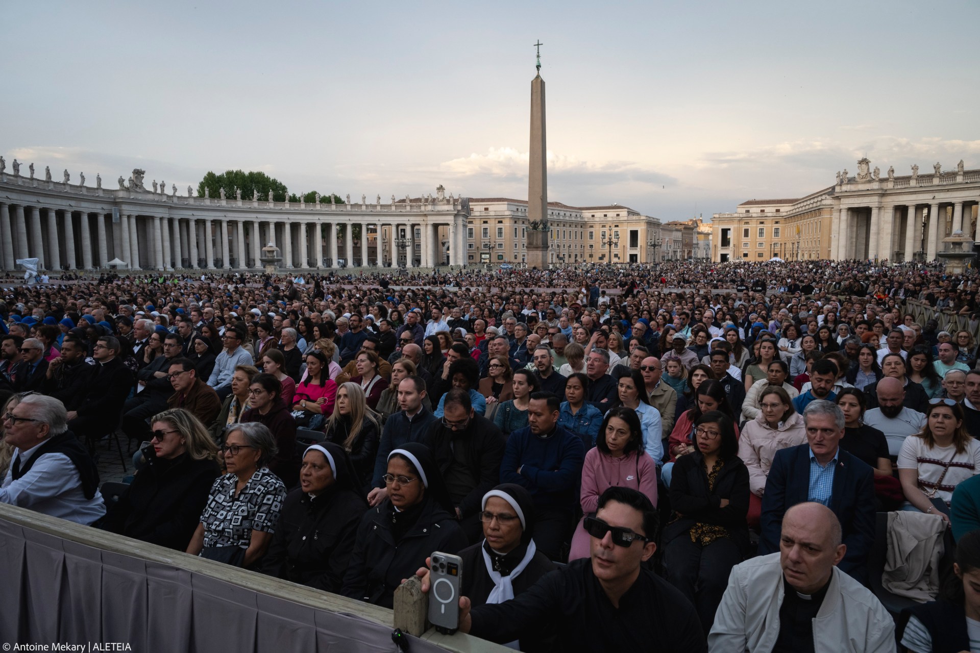 Devotees attend a Rosary in homage to Pope Francis following his death in Saint Peter's Square, the Vatican, on April 21, 2025