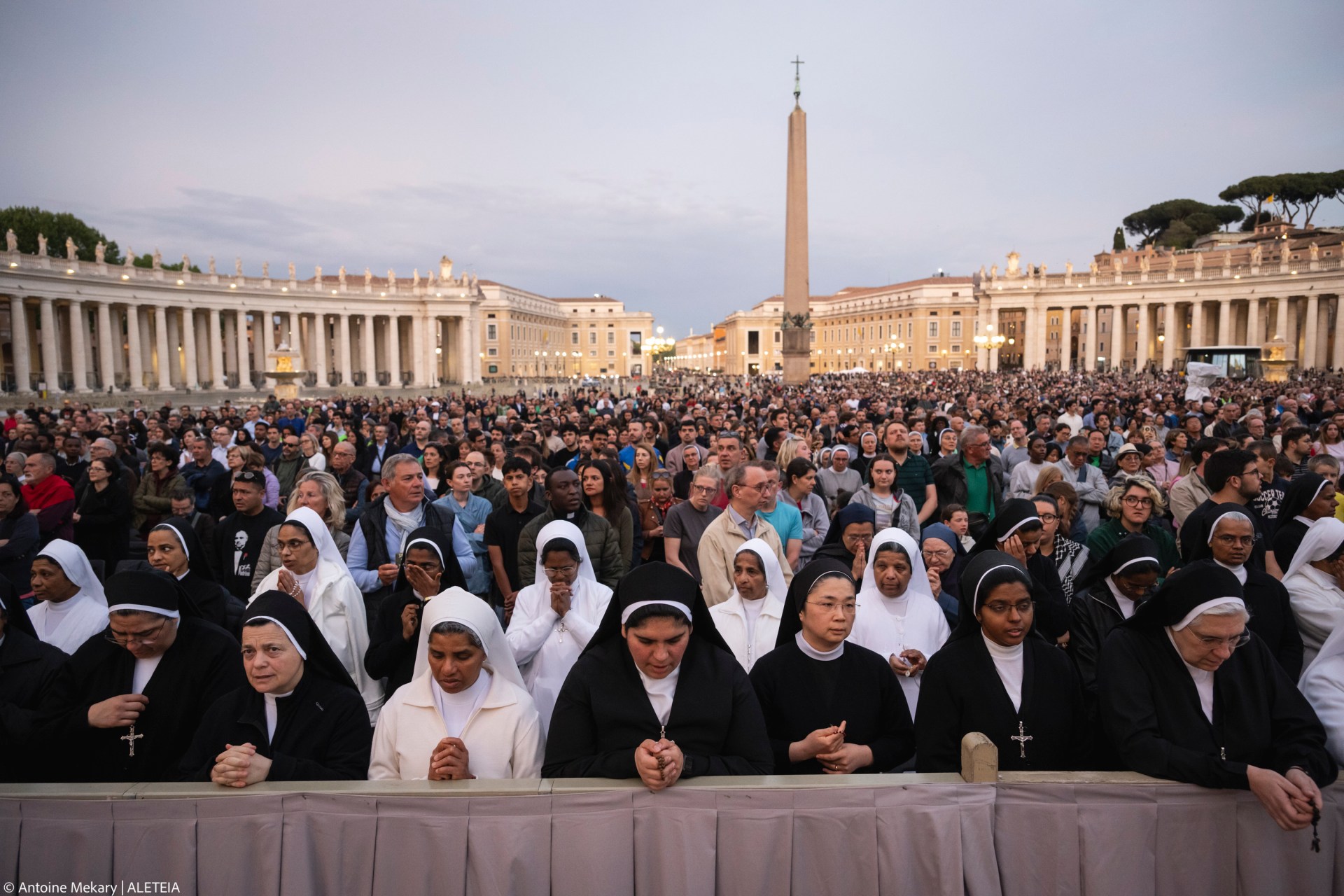 Devotees attend a Rosary in homage to Pope Francis following his death in Saint Peter's Square, the Vatican, on April 21, 2025