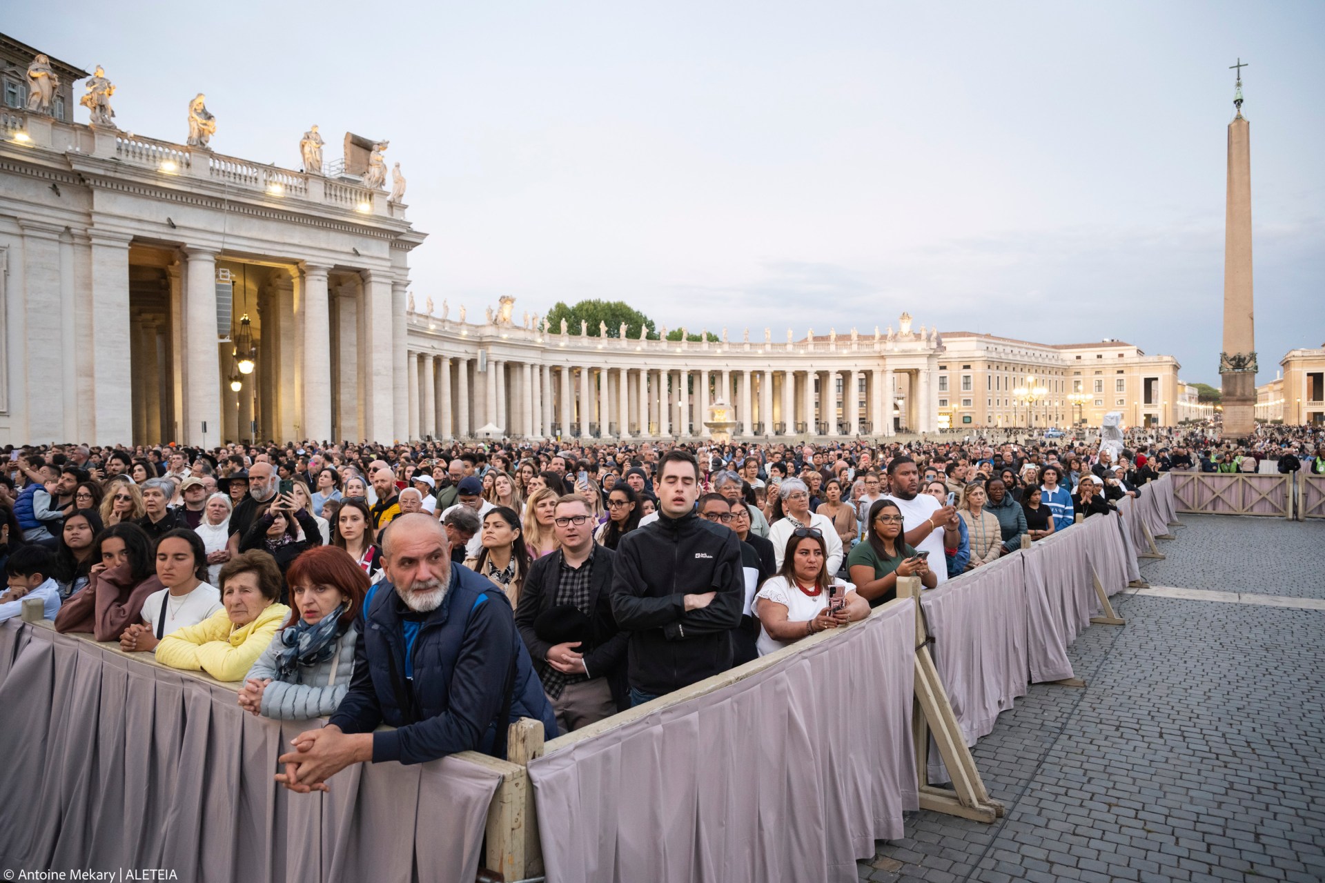 Devotees attend a Rosary in homage to Pope Francis following his death in Saint Peter's Square, the Vatican, on April 21, 2025