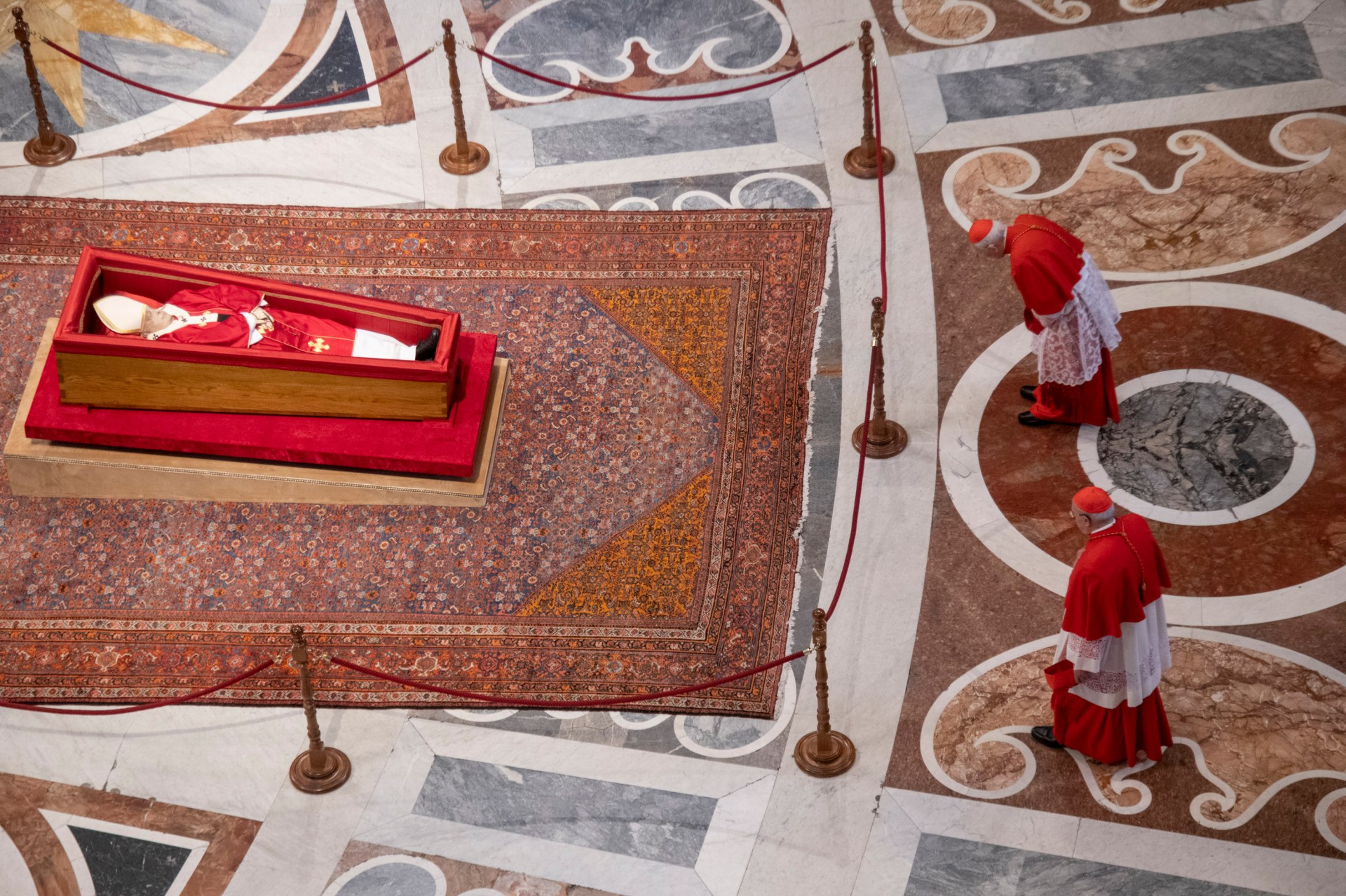 Pallbearers carry the coffin of the late Pope Francis inside St Peter's Basilica as it is transported in a procession from the chapel of Santa Marta to St Peter's Basilica, following the Pope's death, in the Vatican on April 23, 2025.