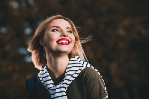 Photo of attractive young cheerful lady