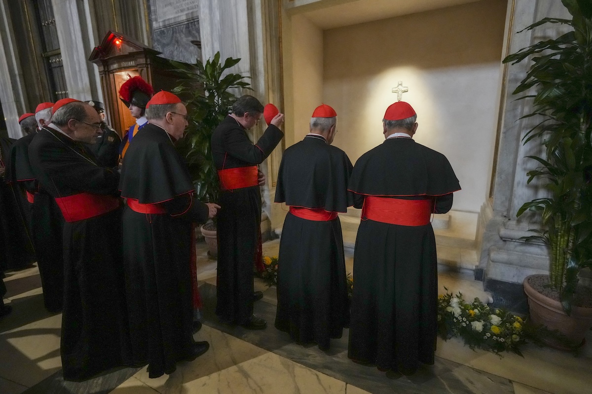 cardinals pray at Pope Francis' tomb