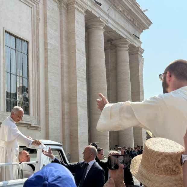 Fr. Damian and the Pope have a moment.