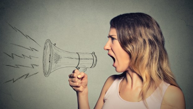 Portrait angry screaming young woman