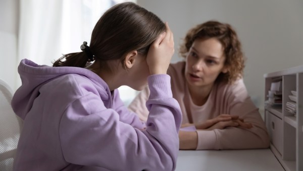 Strict mother scolding upset depressed teenager