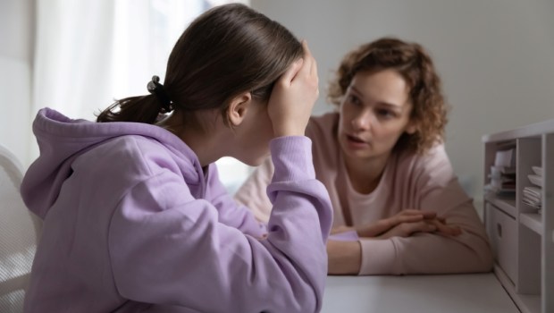 Strict mother scolding upset depressed teenager
