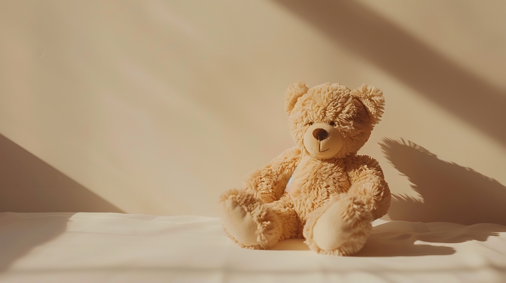 Adorable Teddy Bear in Minimalist Style with Soft Cream Background